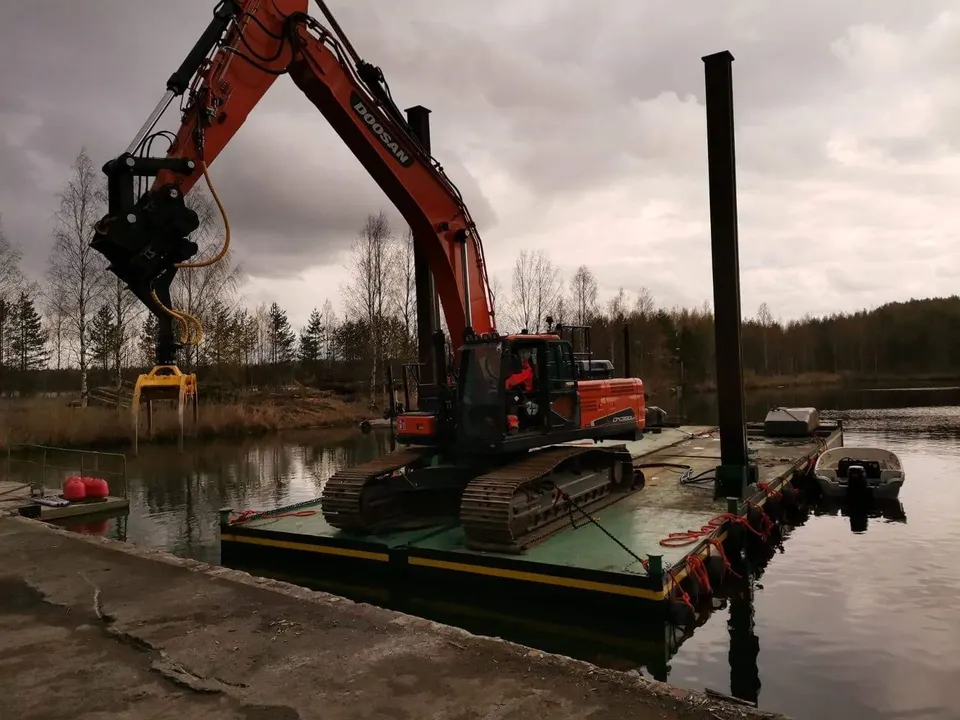 Stalmar pontoon with long-reach excavator working on a dredging project