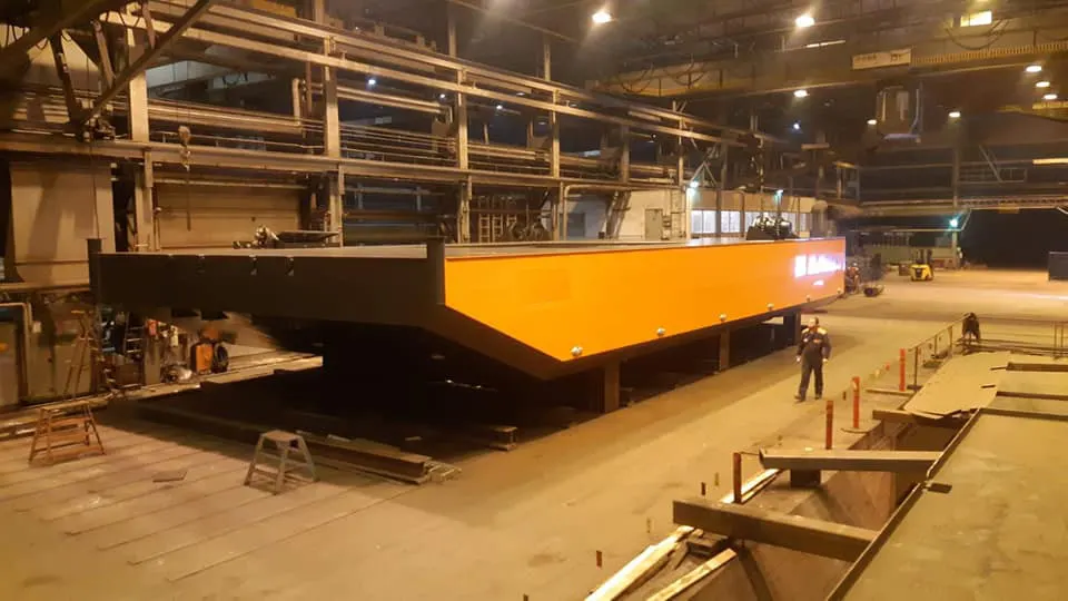 Steel spud barge with excavator in operation