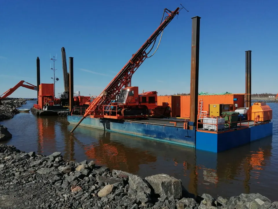 Drilling platform barge in operation on open water